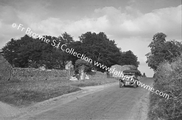 CAR ON COUNTRY ROAD